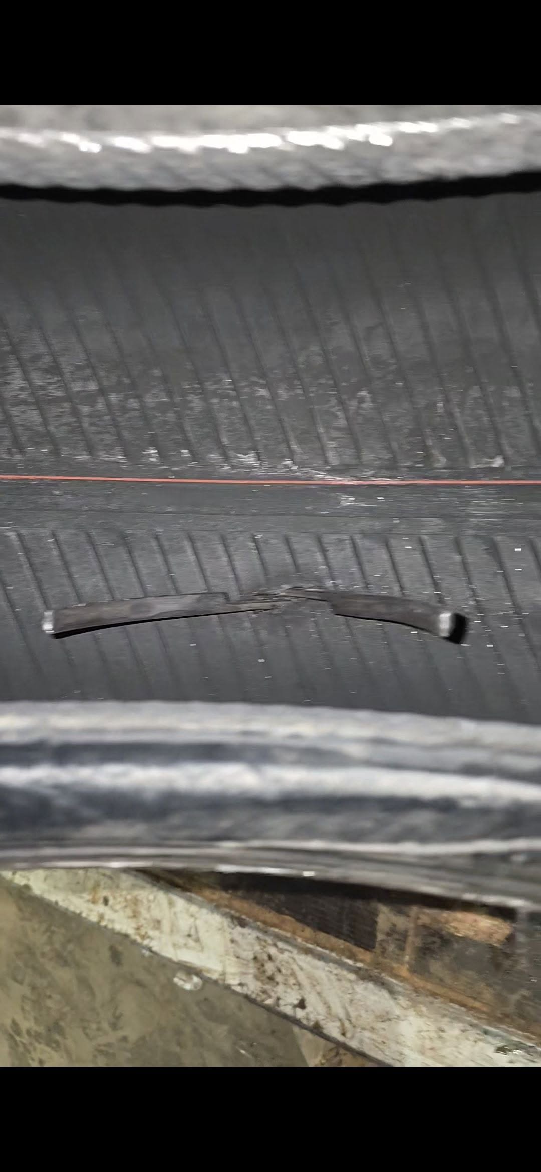 Pliers lying inside a punctured tyre