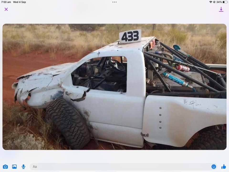 Vehicle damaged after striking an obstacle on a rural dirt road