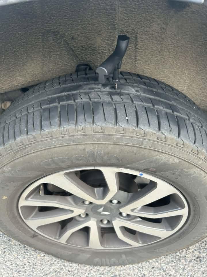 Tech screw embedded in a vehicle tyre
