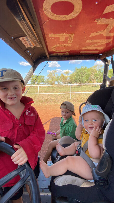 Station crew travelling around a Northern Territory cattle station by ATV