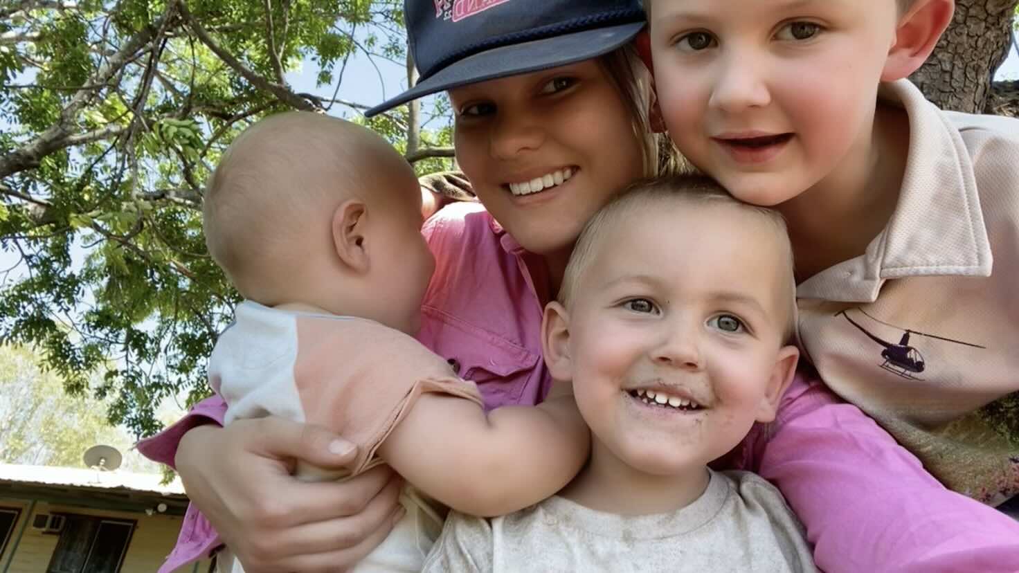 Holly Gorroick spending time with children on a remote cattle station