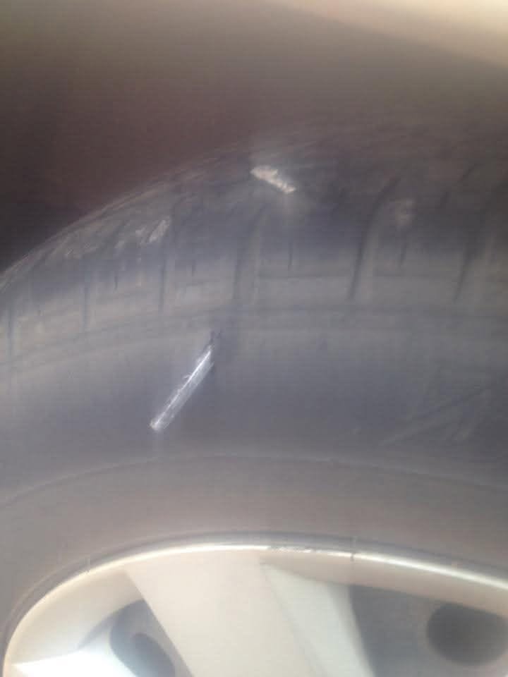 Allen key embedded in a car tyre