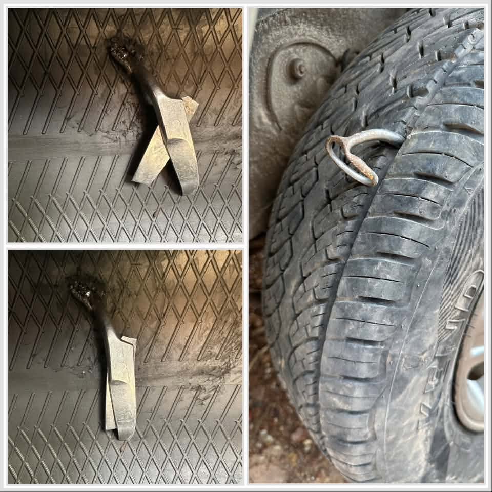 Pair of scissors driven through a vehicle tyre