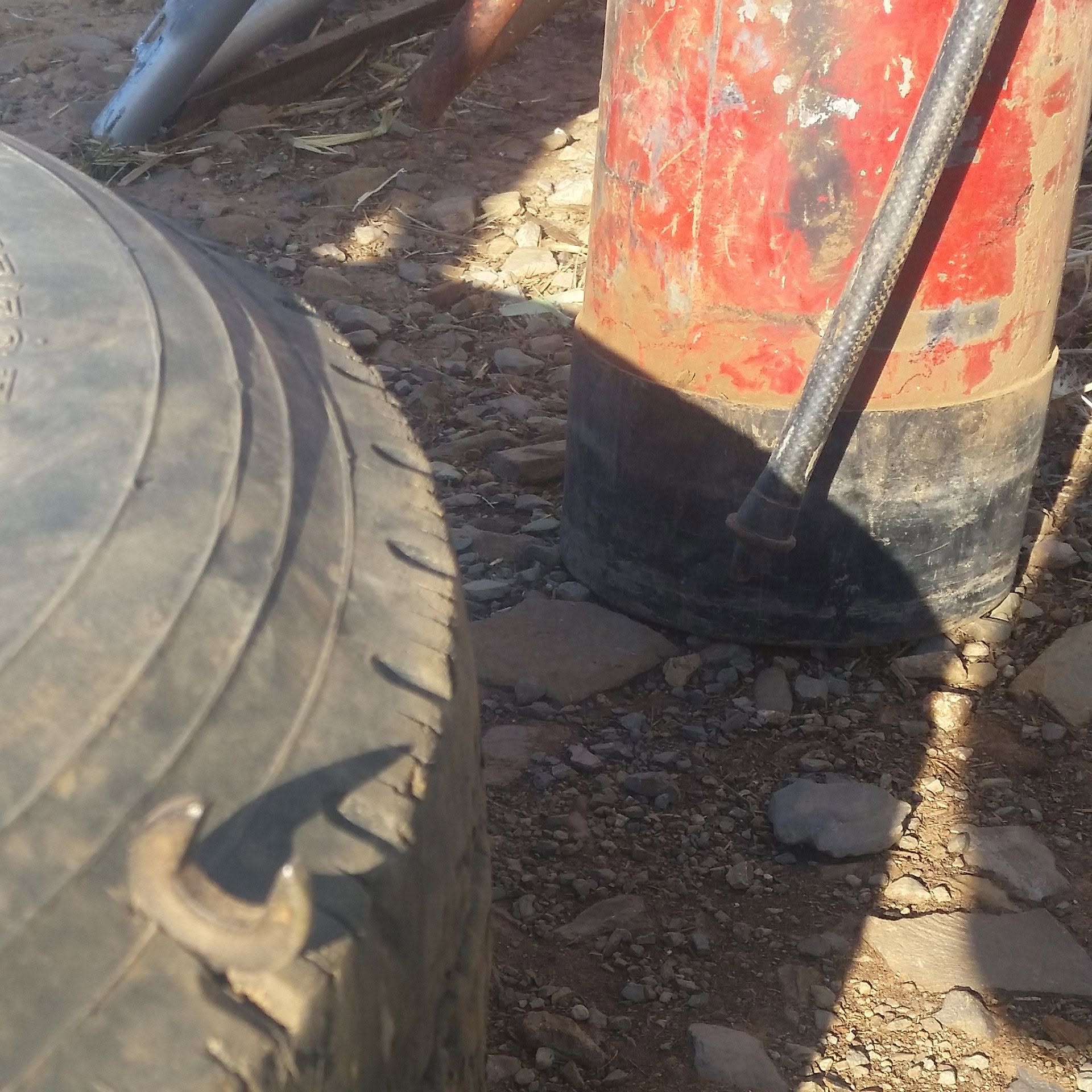 Spanner embedded in a tyre after being picked up in an Australian paddock