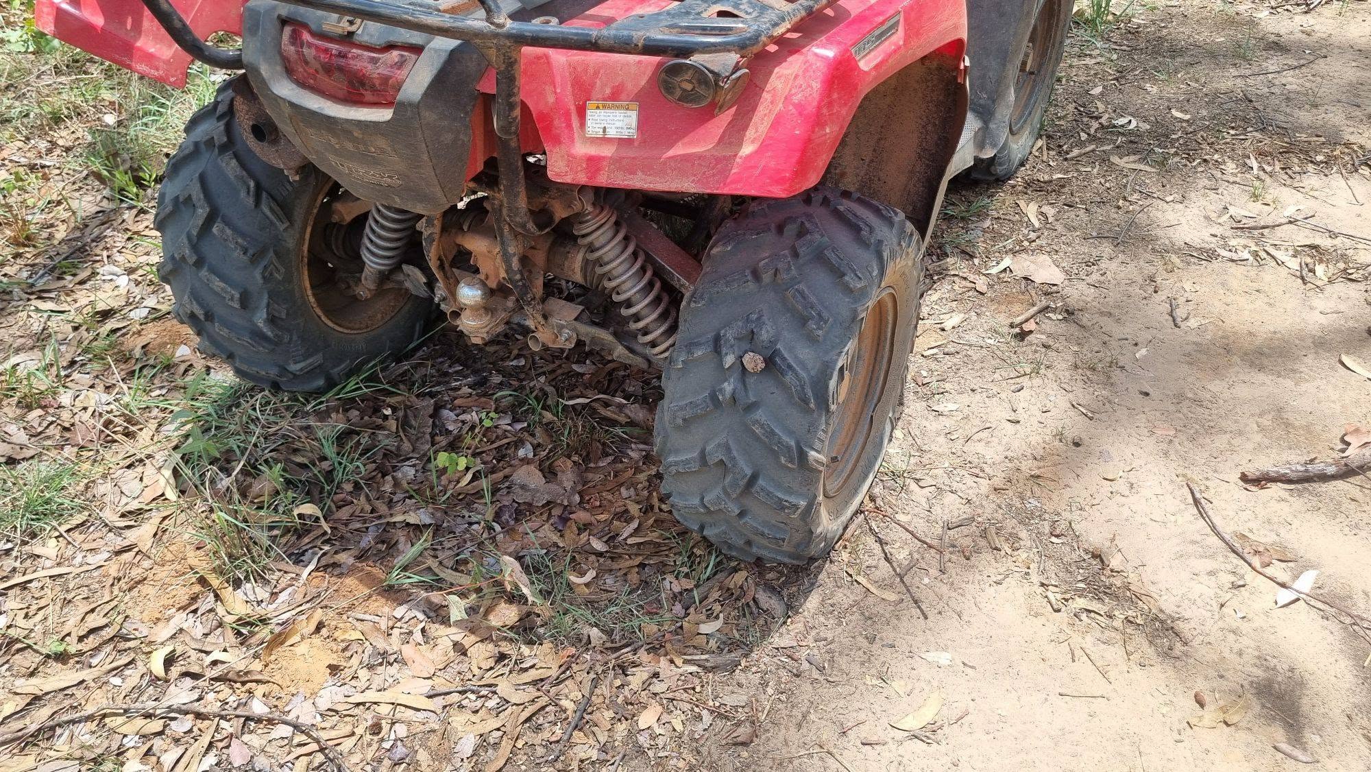 Stick puncturing a quad bike tyre in Cape York